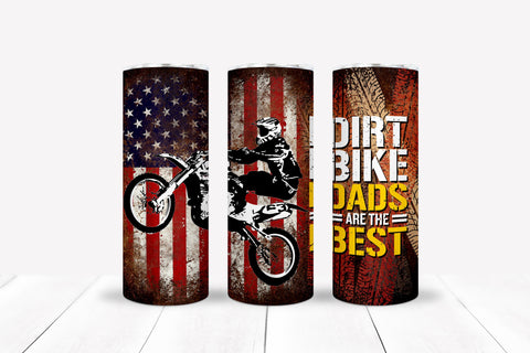 Patriotic red, white, and blue flag dirt bike rider "Dirt Bike Dads Are The Best" slim/skinny 20 oz stainless steel tumbler with clear lid with stainless steel straw.