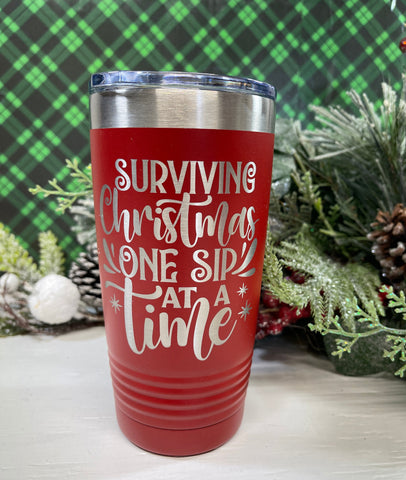 Surviving Christmas One Sip at a Time, Christmas Theme 20 Ounce SS Double Wall Tumbler w/Clear Lid, Coffee Cup, Drink Tumbler, Travel Mug,